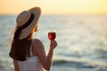 Woman holding glass of wine by the sea Royalty Free Stock Photo