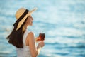 Woman holding glass of wine by the sea Royalty Free Stock Photo