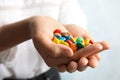 Woman holding glazed candies on light background Royalty Free Stock Photo