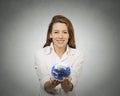 Woman holding glowing earth globe