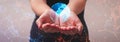 Woman holding a glowing earth globe on her hand a symbol of how to save nature for our children Royalty Free Stock Photo