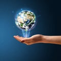 Woman holding a glowing earth globe Royalty Free Stock Photo