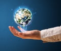 Woman holding a glowing earth globe Royalty Free Stock Photo