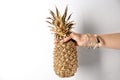 Woman holding golden pineapple Royalty Free Stock Photo