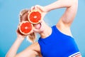 Woman holding grapefruit citrus fruit in hands Royalty Free Stock Photo