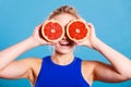 Woman holding grapefruit citrus fruit in hands Royalty Free Stock Photo