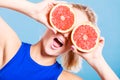 Woman holding grapefruit citrus fruit in hands Royalty Free Stock Photo