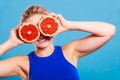 Woman holding grapefruit citrus fruit in hands Royalty Free Stock Photo