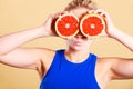 Woman holding grapefruit citrus fruit in hands Royalty Free Stock Photo