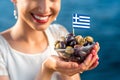 Woman holding greek olives Royalty Free Stock Photo