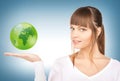 Woman holding green globe on her hand Royalty Free Stock Photo