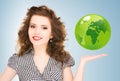 Woman holding green globe on her hand Royalty Free Stock Photo