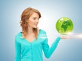 Woman holding green globe on her hand Royalty Free Stock Photo