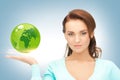 Woman holding green globe on her hand Royalty Free Stock Photo