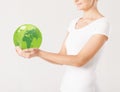 Woman holding green sphere globe Royalty Free Stock Photo