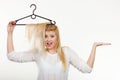 Woman holding hair on clothes hanger