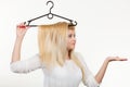 Woman holding hair on clothes hanger