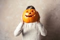 Woman holding Halloween pumpkin head jack lantern Royalty Free Stock Photo