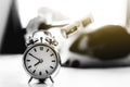 Woman holding hammer on alarm clock, Royalty Free Stock Photo