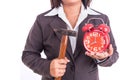 Woman holding hammer and red alarm clock isolated on white. Breaking time concept Royalty Free Stock Photo
