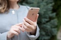 Woman holding in the hand iPhone 6 S Rose Gold