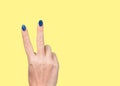 Woman holding hand with two fingers up making v sign Royalty Free Stock Photo