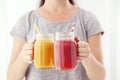 Woman holding in hands glass jars