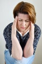 Woman holding hands on head, depression, pain, migraine Royalty Free Stock Photo