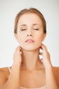 Woman holding hands on her neck Royalty Free Stock Photo
