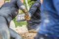 Woman holding hands in mud. Royalty Free Stock Photo