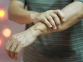 Woman holding hands rare disorder body immune system attacks nerves, Guillan Barre Syndrome, Vaccine covid-19 coronavirus