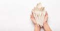 Woman holding in hands set of biodegradable single use cutlery