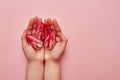 Woman holding in hands tree red tulips heads, copy space