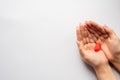 Woman holding heart on blue background, top view with space for text. heart on hand for philanthropy. woman holding red heart in Royalty Free Stock Photo