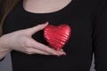 Woman holding a heart shape against her body Royalty Free Stock Photo