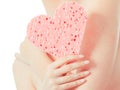 Woman holding heart sponge closeup Royalty Free Stock Photo