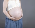 Woman holding her baby bump