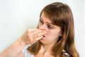 Woman holding her nose - bad smell concept Royalty Free Stock Photo
