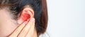 Woman holding her painful Ear. Ear disease, Atresia, Otitis Media, Inflation, Pertorated Eardrum, Meniere syndrome,