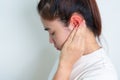 Woman holding her painful Ear. Ear disease, Atresia, Otitis Media, Inflation, Pertorated Eardrum, Meniere syndrome, Royalty Free Stock Photo