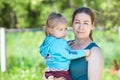 Woman holding her two-year-old daughter in her arms Royalty Free Stock Photo