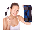 Woman holding hinged knee braces.