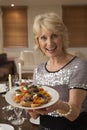 Woman Holding Hors D'oeuvres On Plate Royalty Free Stock Photo