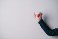 Woman holding hot cup of coffee with heart Royalty Free Stock Photo