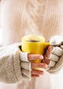 Woman holding hot steaming coffee cup close up photo Royalty Free Stock Photo