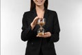 Woman holding hourglass on light background. Time management concept Royalty Free Stock Photo