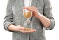 Woman holding hourglass on white background. Time management concept Royalty Free Stock Photo