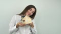 Woman holding a house in her hands.