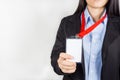 Woman holding Identification card.