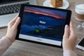 Woman holding iPad Pro Space Gray with hosting Flickr